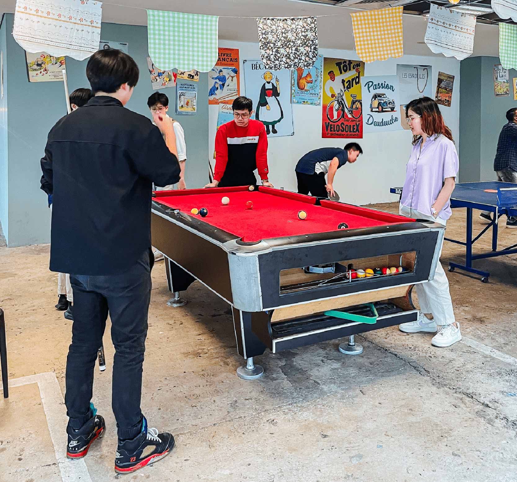 Game area with billiard, soccer table, and ping pong at Menara Sun Life