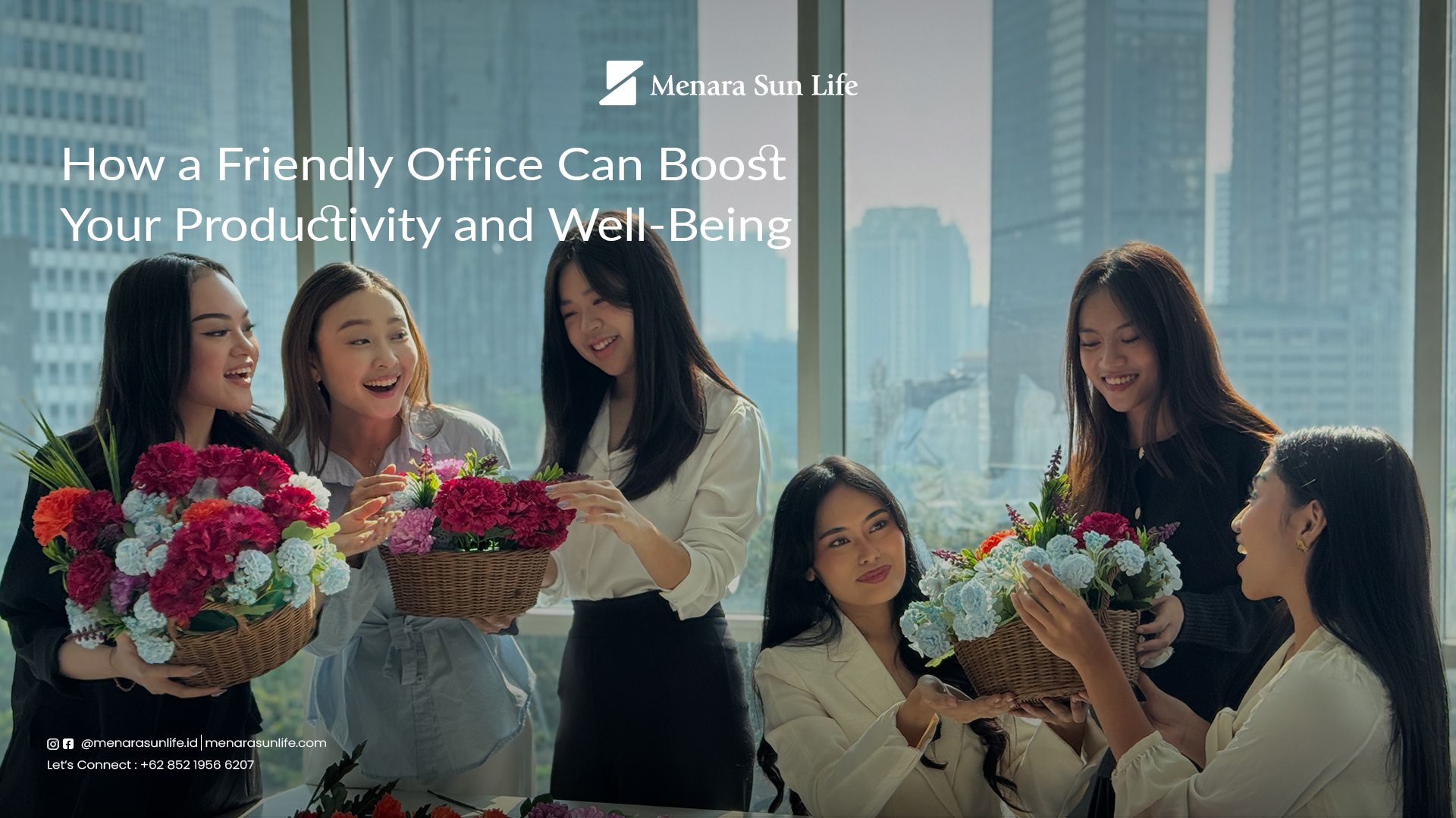 How a Friendly Office Can Boost Your Productivity and Well-Being A group of women arranging flowers in a bright office at Menara Sun Life, demonstrating a friendly and productive workspace.
